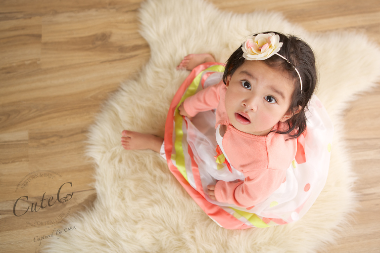 baby with flower in her hair