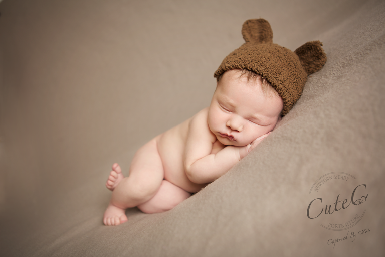 newborn in bear hat