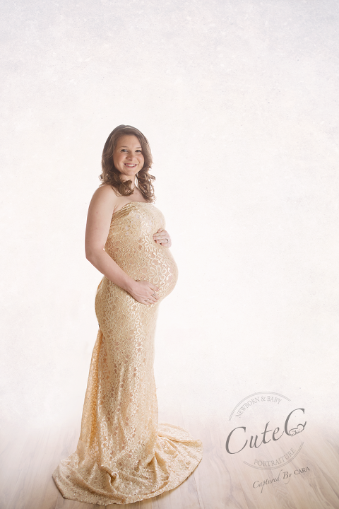 pregnant in gold dress